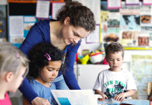 Teacher working with students