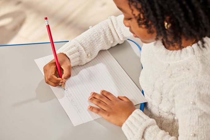 Girl writing on a page