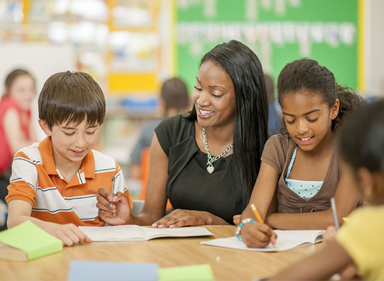 Teacher and children in classroom